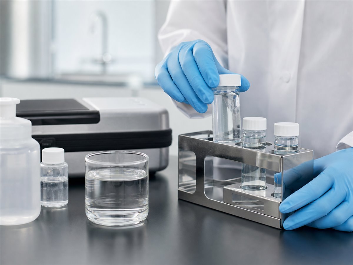Technician preparing water samples for disinfection testing